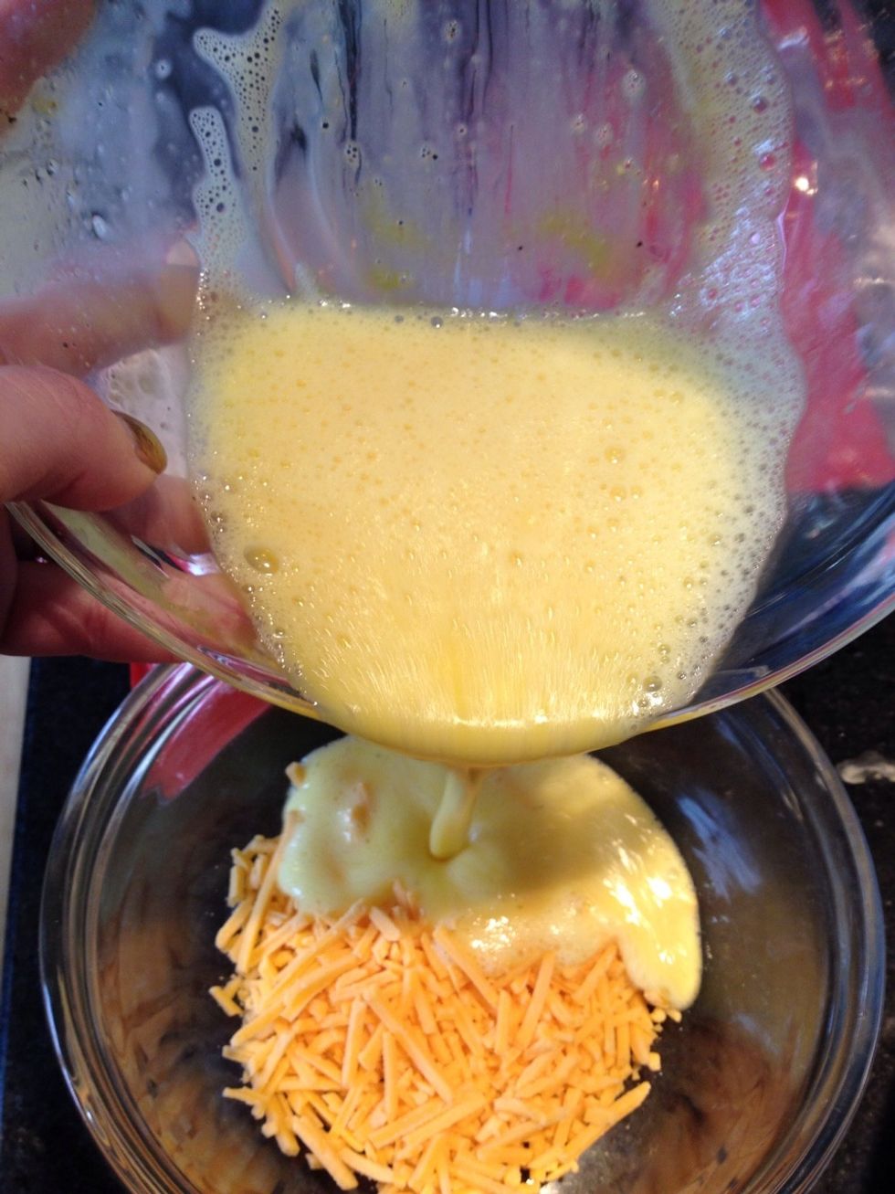 Pour eggs over cheese. You want the mixture to reach about a half inch below top of dish.