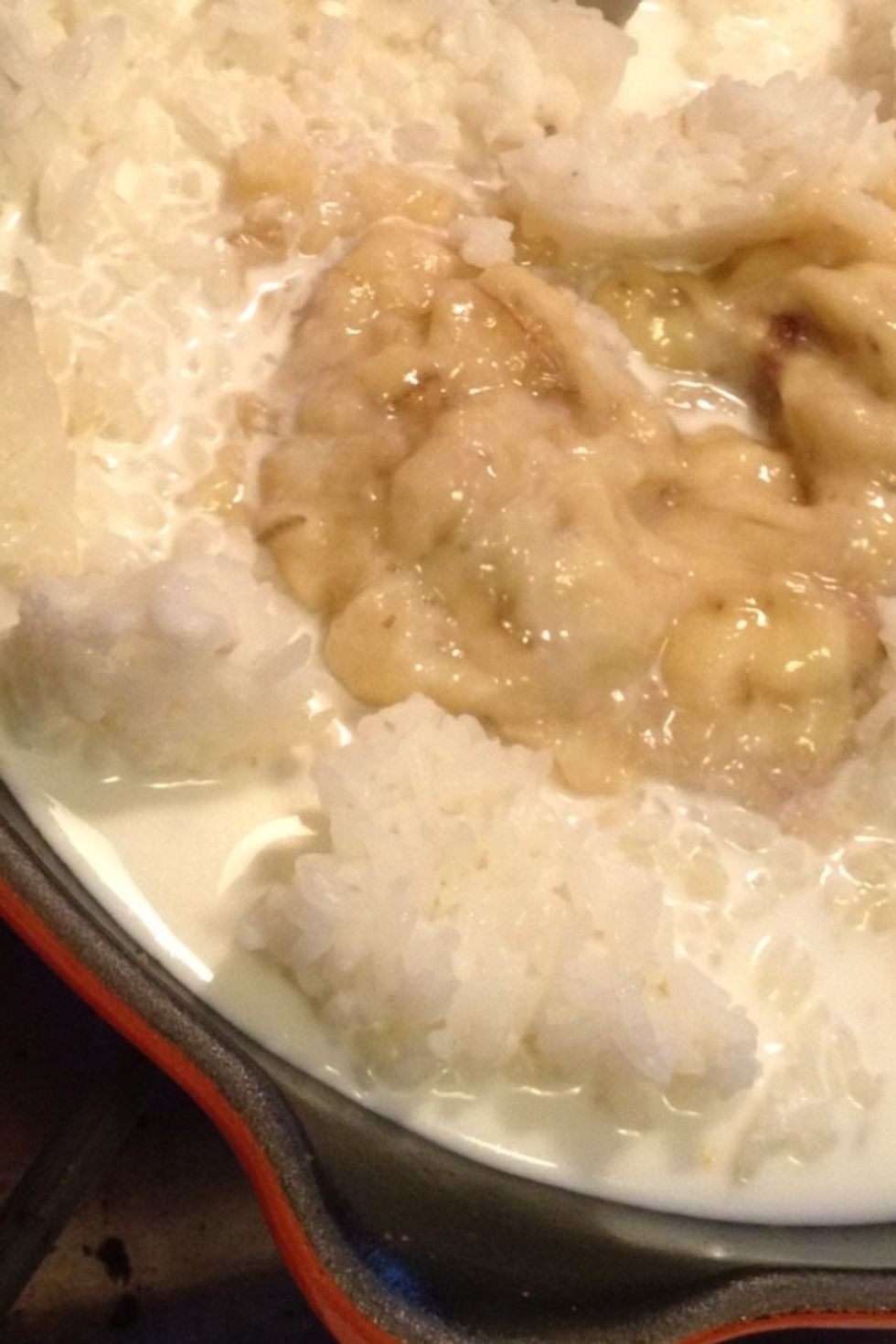 Pour enough milk into your pan to just cover the rice. I used some half and half as well so that I wouldn't run out of either one. Oh, you have half a box of soymilk? That works too. Almond? Great.
