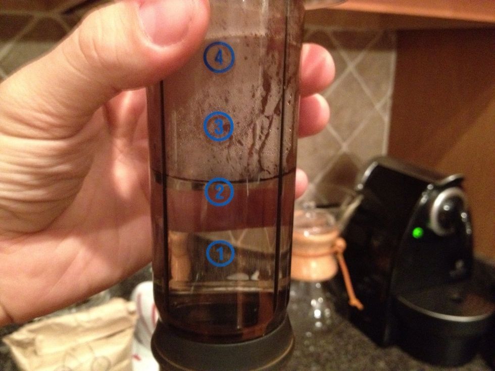 Pour enough water into the plunger to fill it just above the 2 mark.