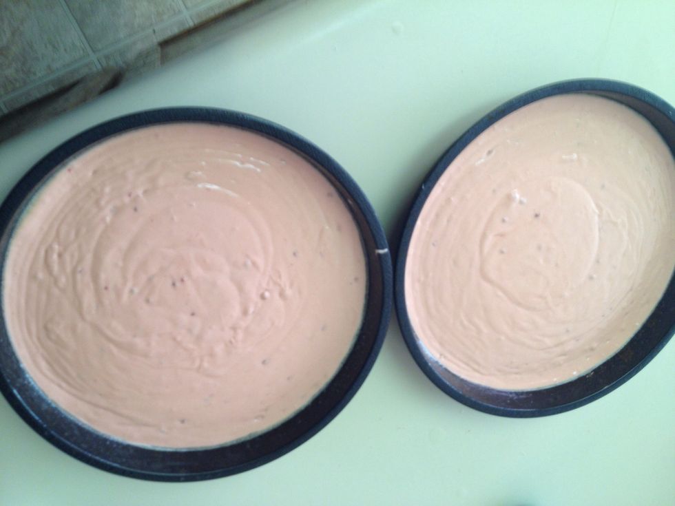 Pour equal amounts into 2 cake pans. I sprayed mine with non stick spray before doing so.
