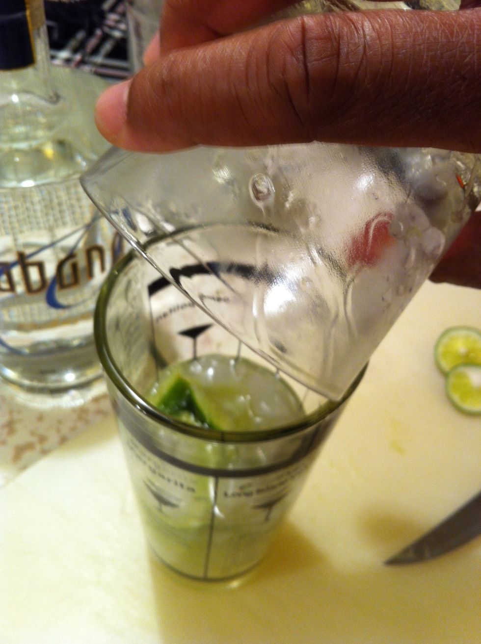 Pour everything into a shaker glass.