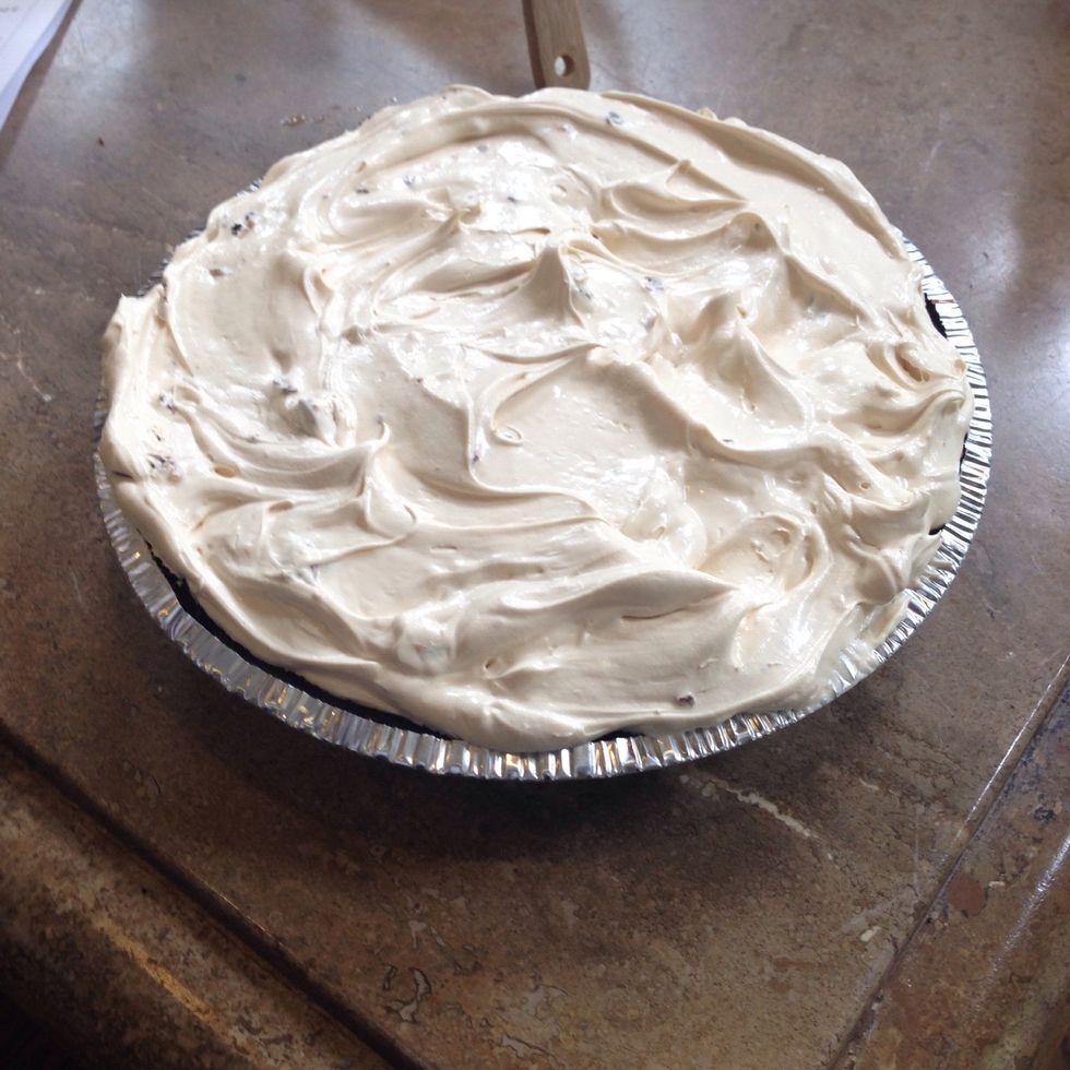 Pour filling into pie crust, spreading evenly with knife or spatula.