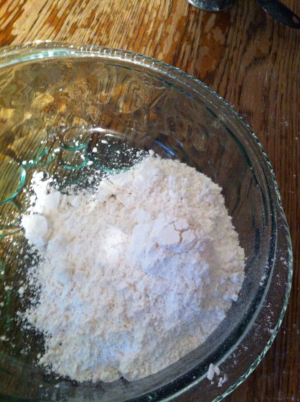 Pour flour in medium bowl