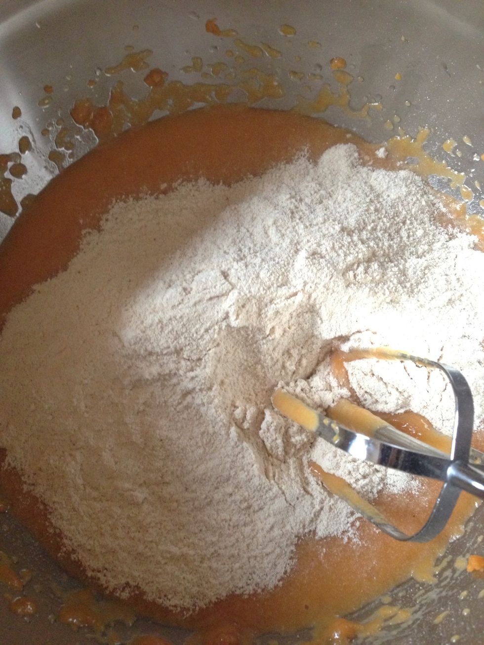 Pour flour mixture into pumpkin mixture slowly and mix at a low speed until thoroughly combined and batter is smooth.