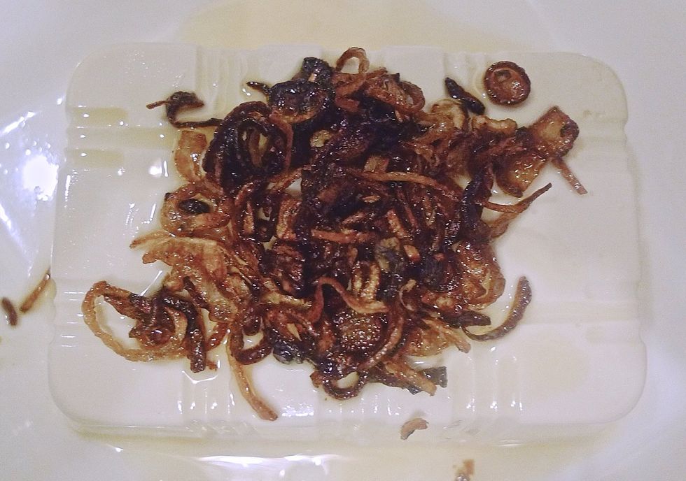 Pour fried shallots and hot shallot oil over the bean curd.