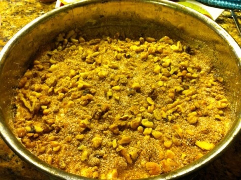 Pour half of the batter into a greased baking pan and sprinkle with half of the topping.  Add the remainder of the batter on top, and sprinkle with the remaining topping.