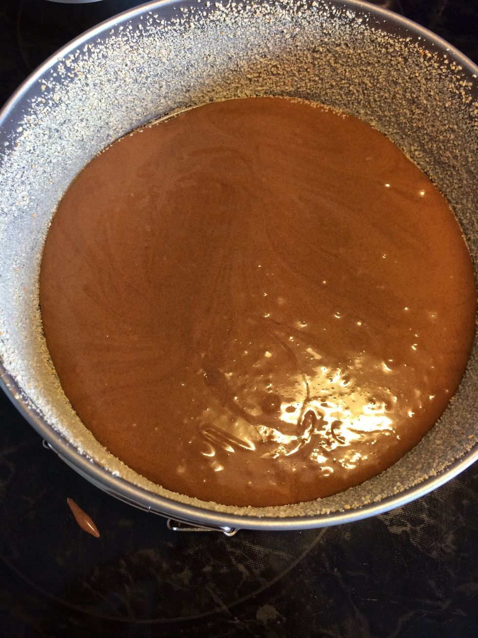 Pour half of the dough into the dish.