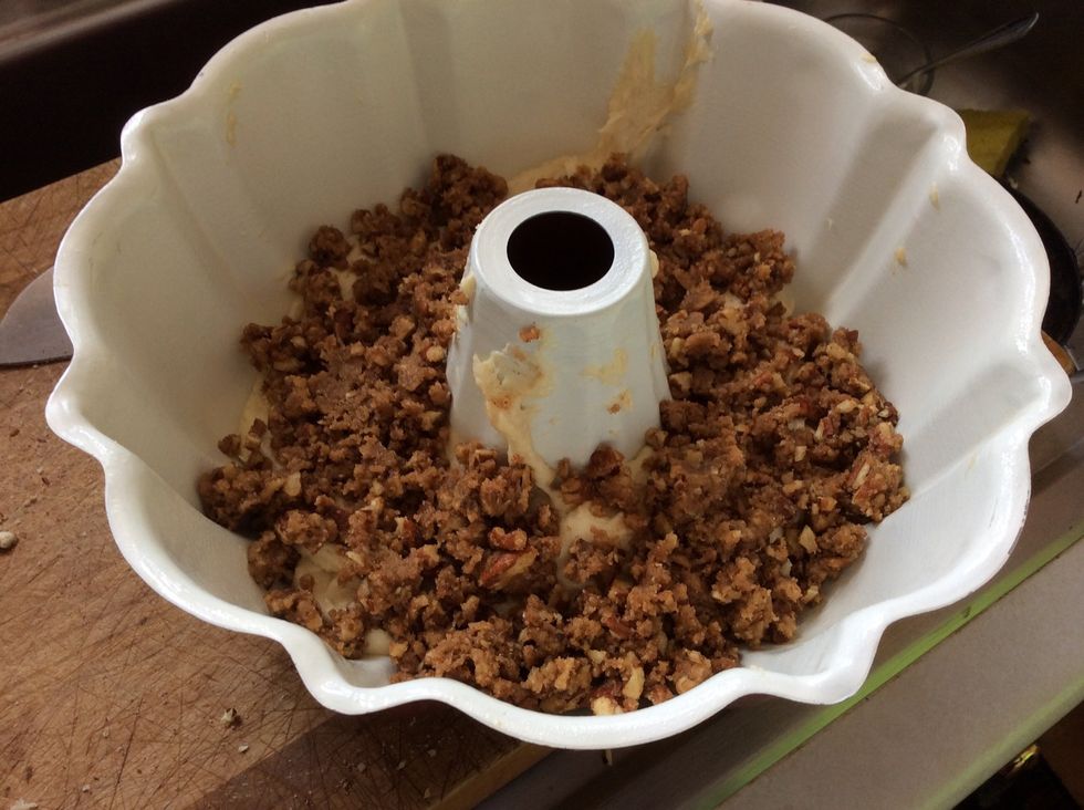Pour half of the pecan mix (second bowl) on top of the cake mix.