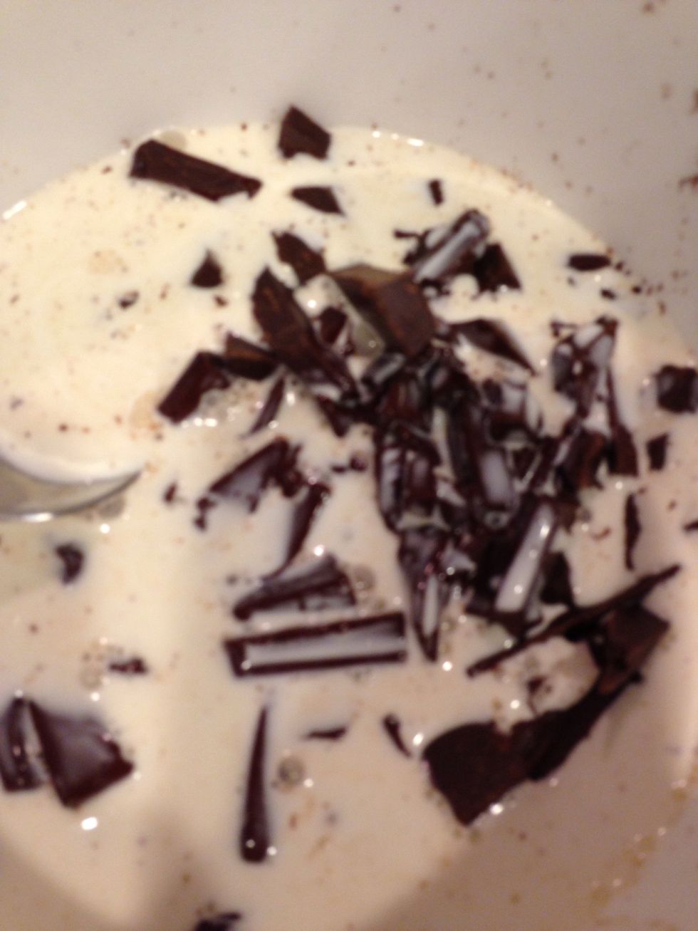 Pour heated up cream to chopped chocolate.