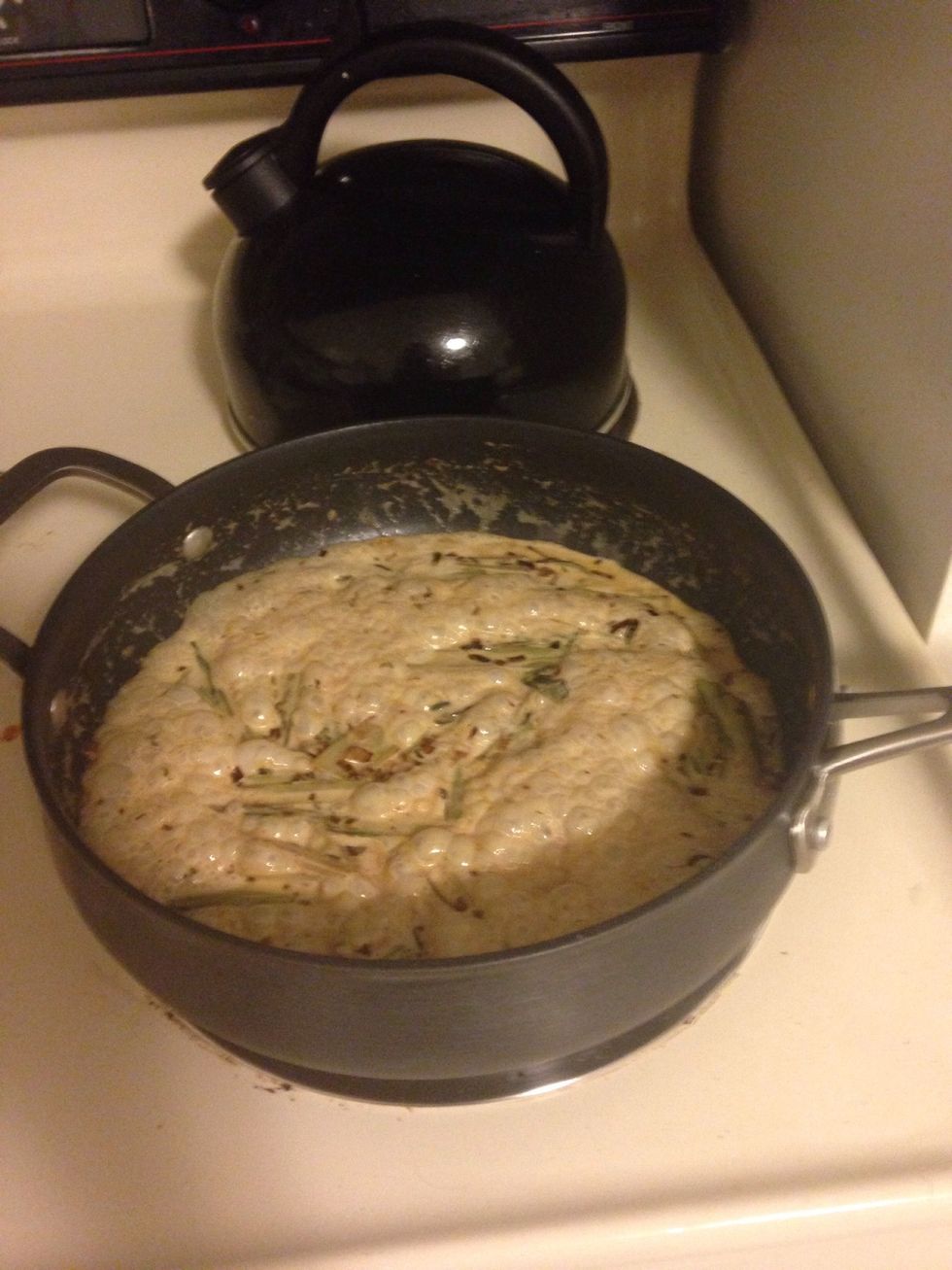 Pour heavy cream into saucepan, bring to a boil, and simmer, stirring constantly until reduced.