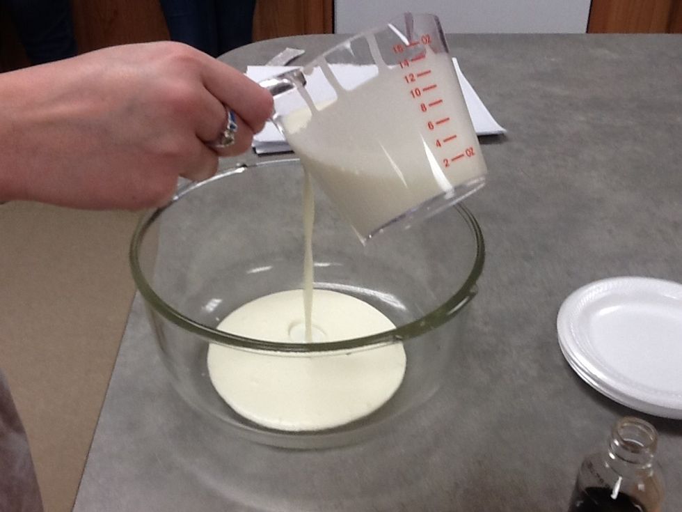 Pour heavy whipping cream into mixing bowl.