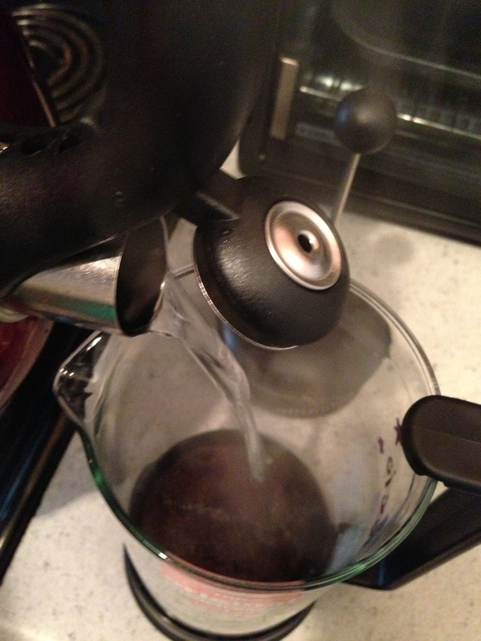 Pour hot water into the coffee press