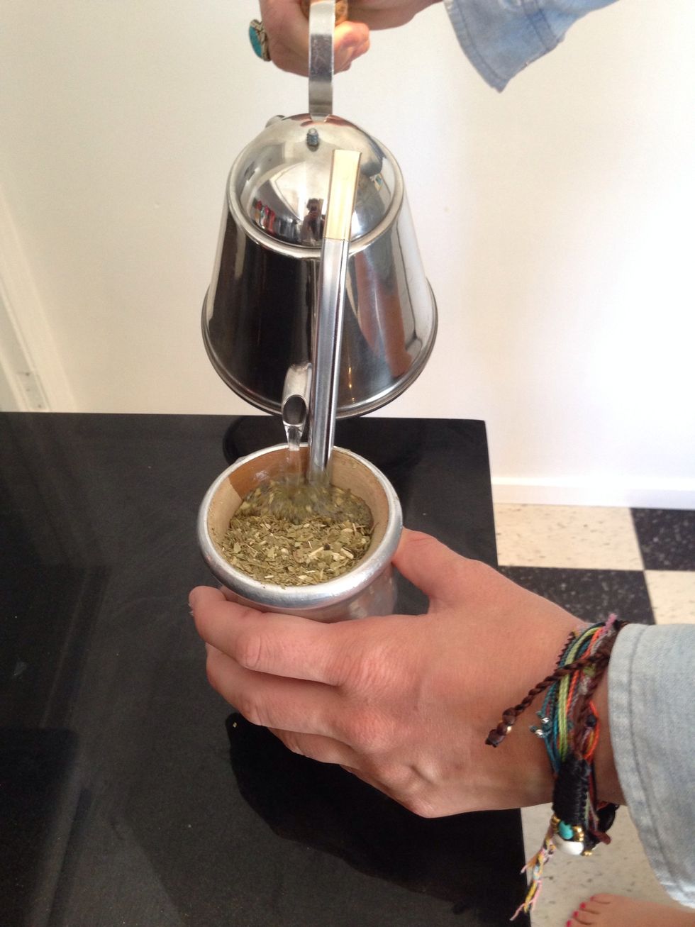 Pour hot water, making sure you pour directly over the bombilla, as not to wet all the yerba mate
