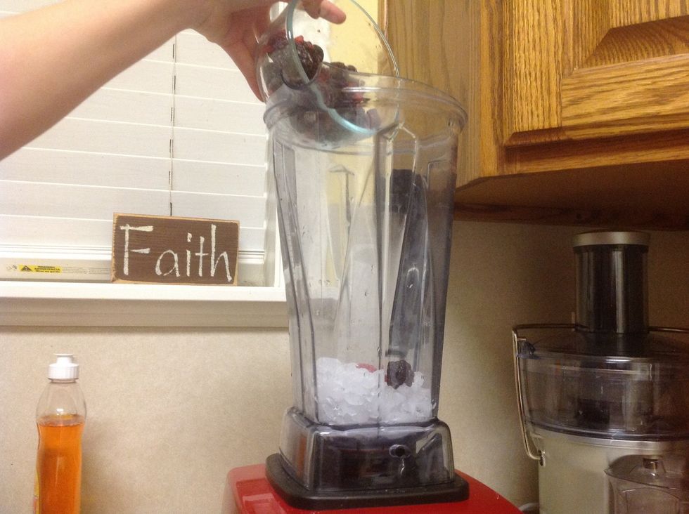 Pour in 1 1/2 cups of mixed berries in the blender.