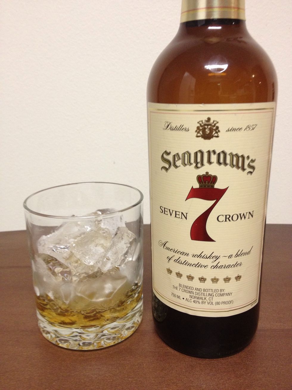 Pour in 1-1/4 oz (a shot) of Seagrams