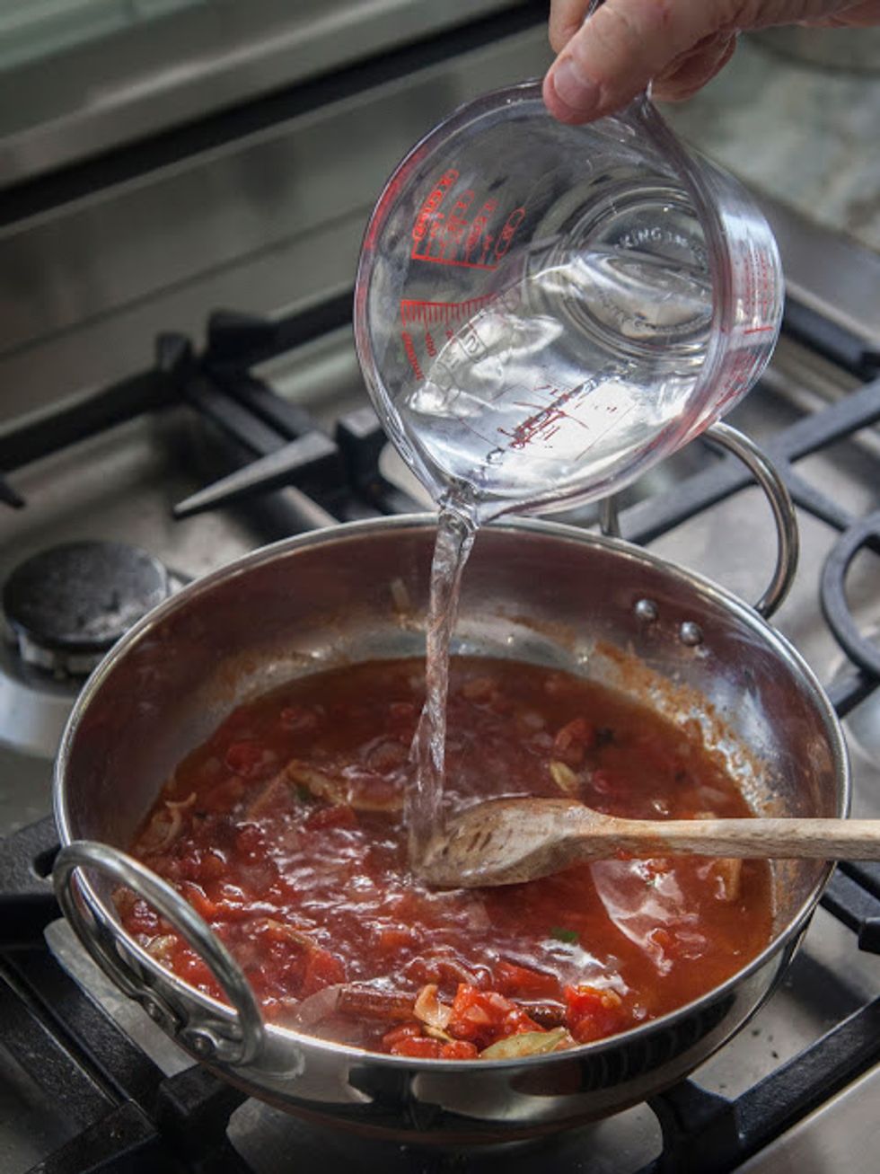 pour in 1 cup of water.Bring everything to a boil, then put a lid on the pot and turn it down to a simmer. Stir it occasionally.