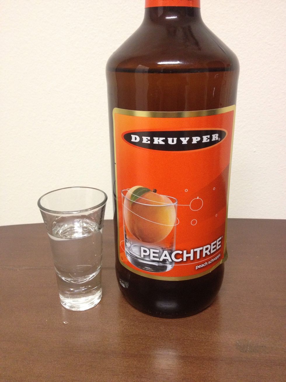 Pour in 1 oz of some Peach Schnapps into your Shot Glass.
