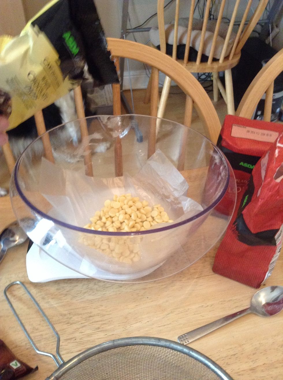 Pour in 3/4 of chocolate chips (milk or white) and leave the rest until the end