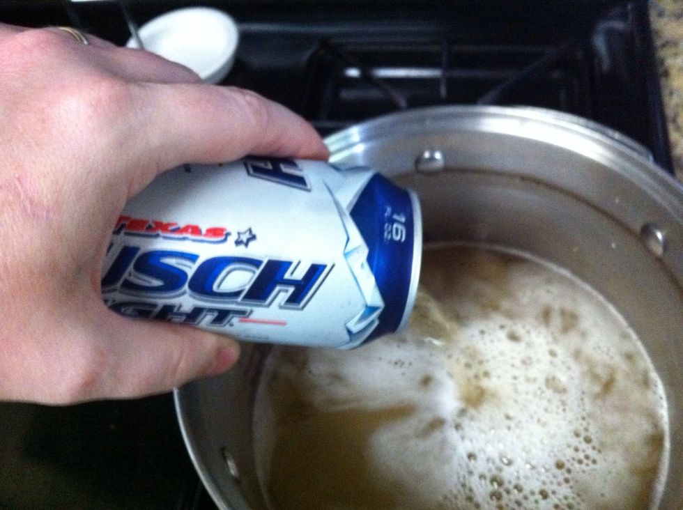 Pour in (3) cans of beer and (1) bottle apple juice in sauce pan. Clear off froth for better visibility. Bring to a boil.