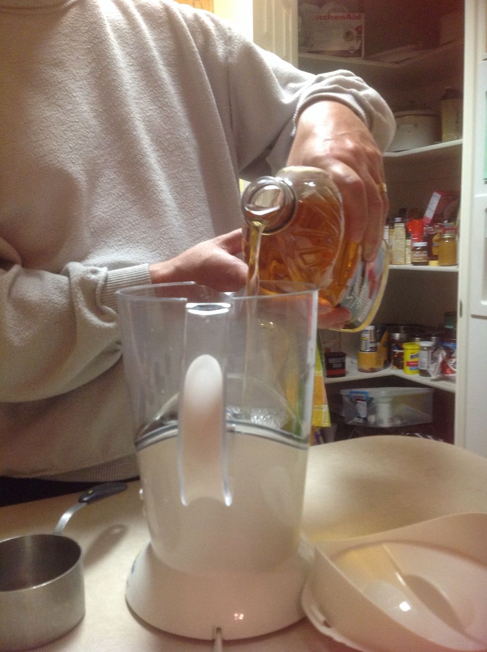 Pour in 5 cups of apple juice.