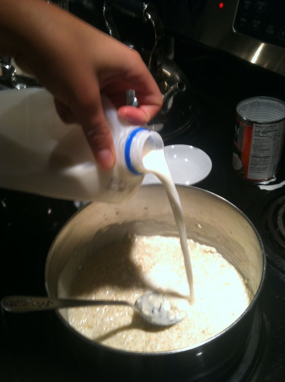 Pour in about a cup of milk. Continue adding milk and coconut cream as needed while you cook.
