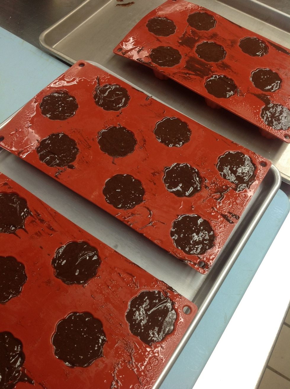 Pour in batter and scrape.