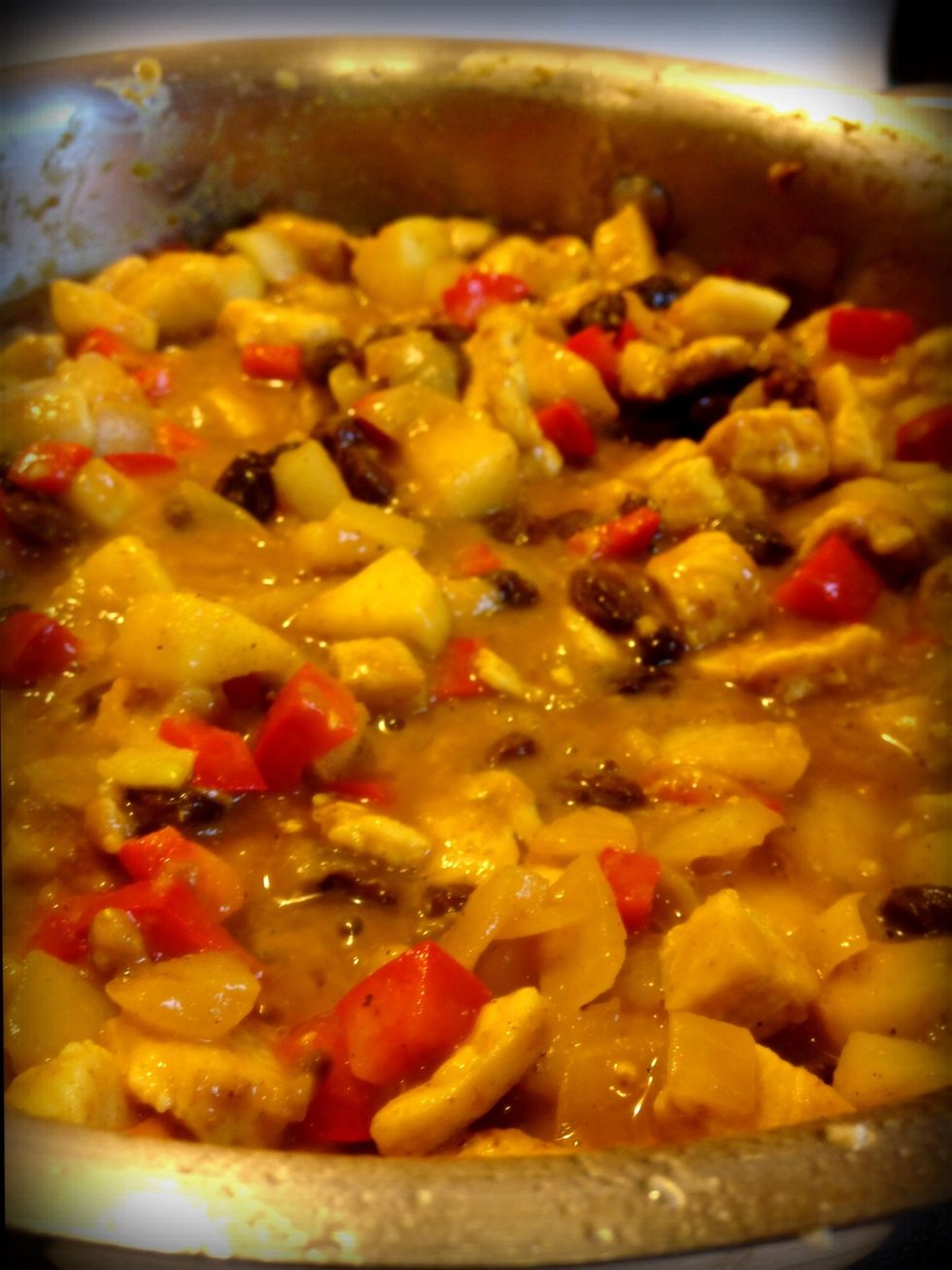 Pour in broth and raisins. Stir. Reduce heat to low and simmer for 20 minutes to blend flavors (about the time it takes to cook the basmati rice).