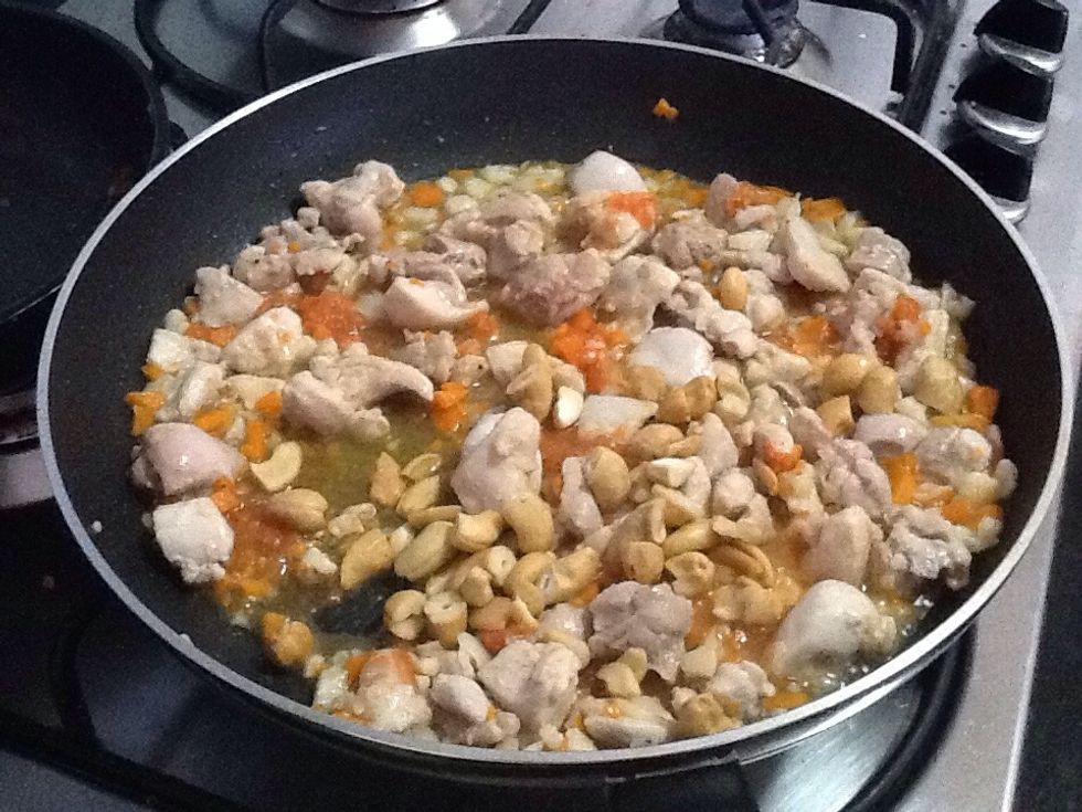 Pour in cashews and spread evenly. Then cook on medium heat for around 10 minutes.