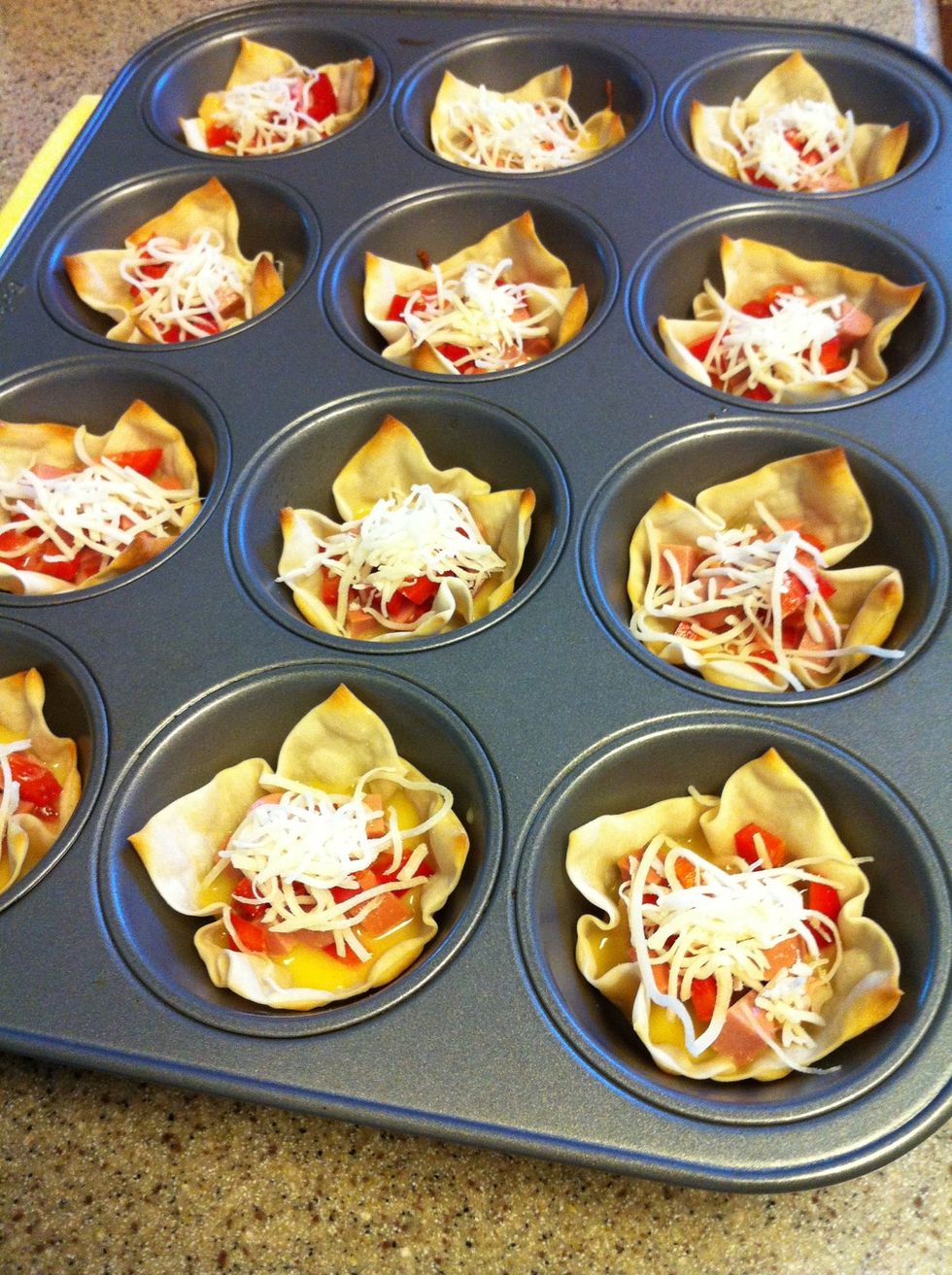 Pour in egg mixture and top with cheese. Bake for another 10 minutes {or until the egg are set & wonton are crisp golden brown}