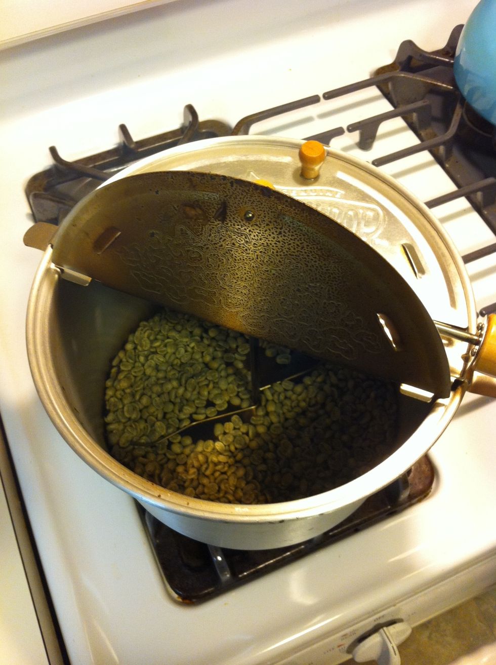 Pour in enough beans to cover the bottom of your popper. Close the lid (air temp is important here) and spin the agitator constantly at a steady rate until you reach desired roast... (See next step)