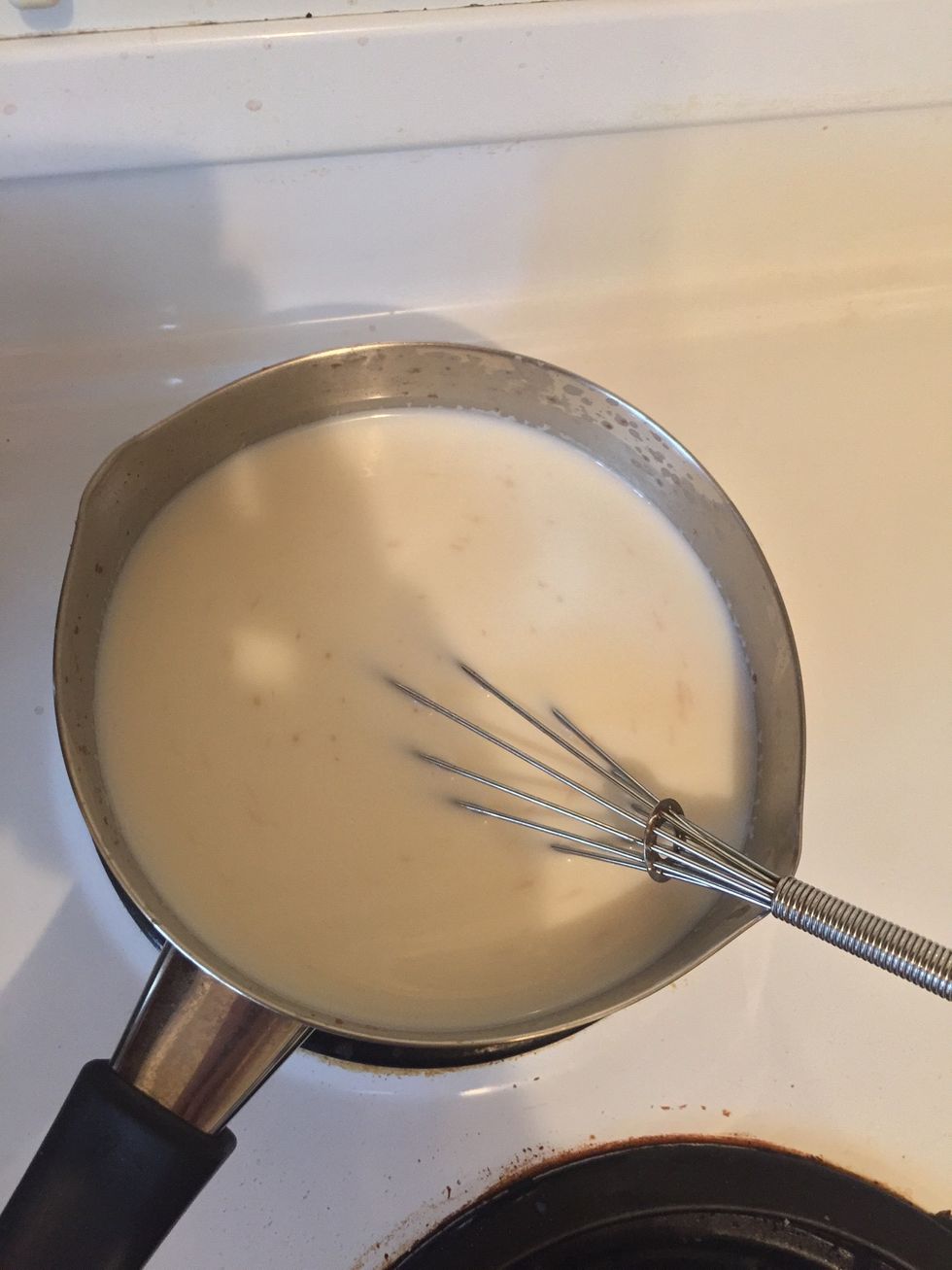 Pour in measured cup of milk (1 cup)