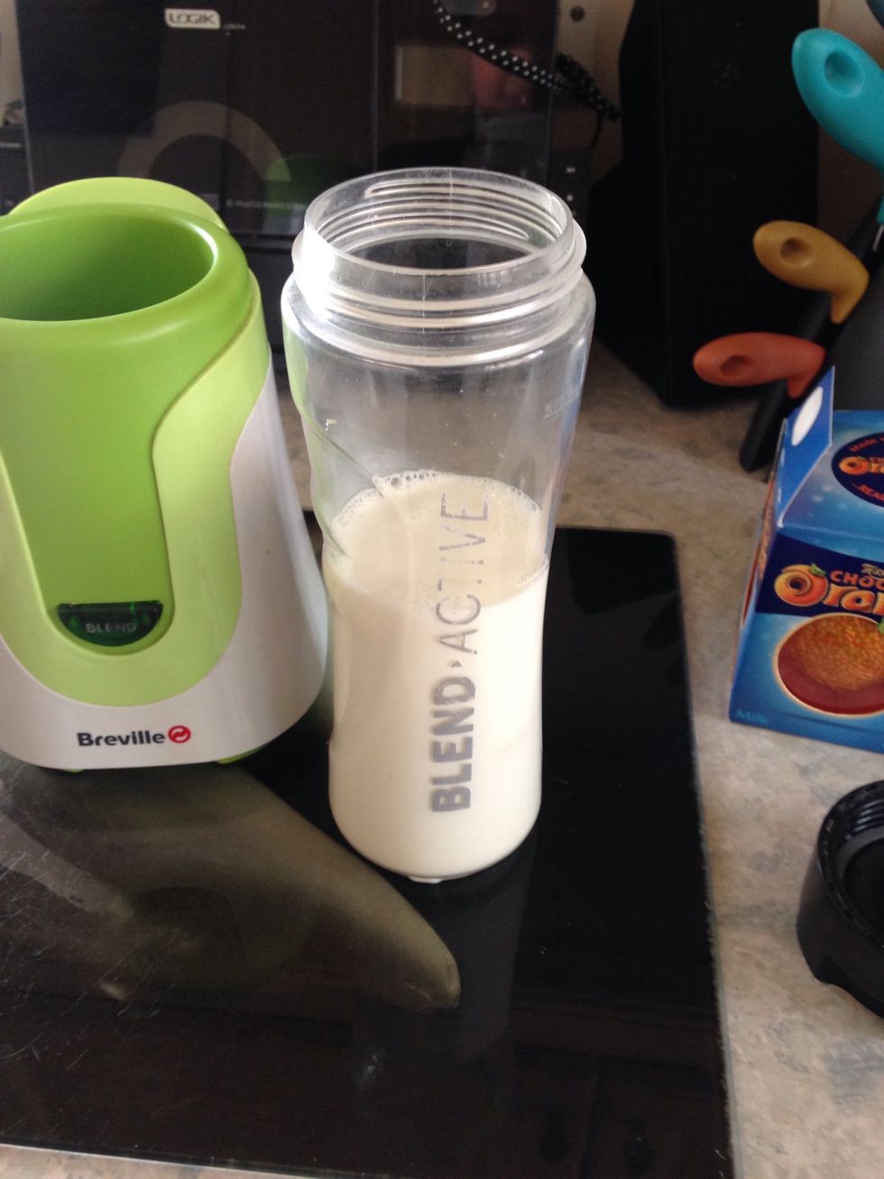 Pour in milk . Probably around half a glass