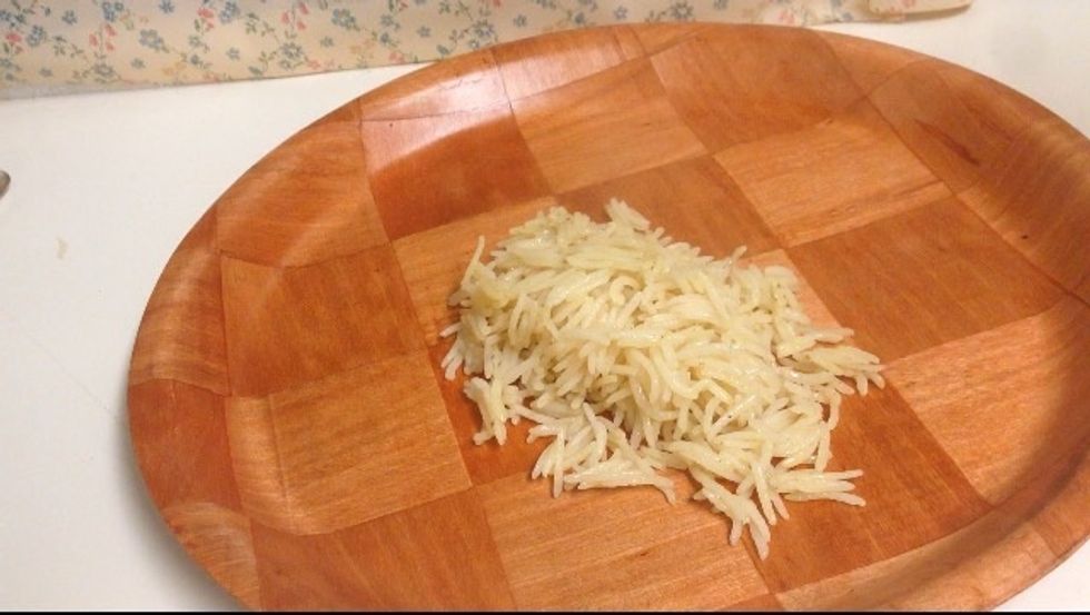 Pour in rice into a big plate