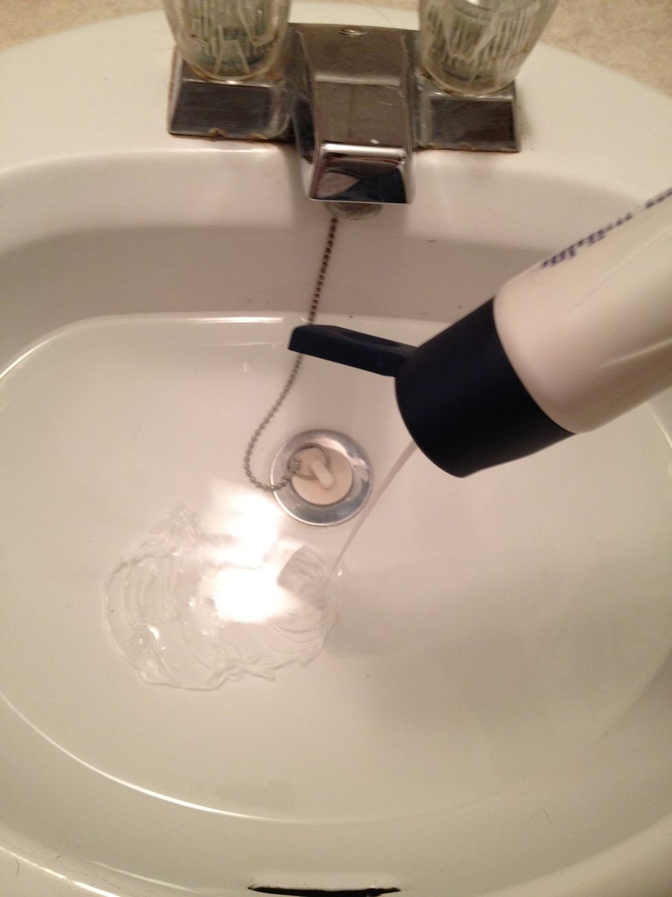 Pour in shampoo. The amount you use also depends on the length of the wig. Short wigs only need a small amount while longer wigs may use up to a palm-full of shampoo.