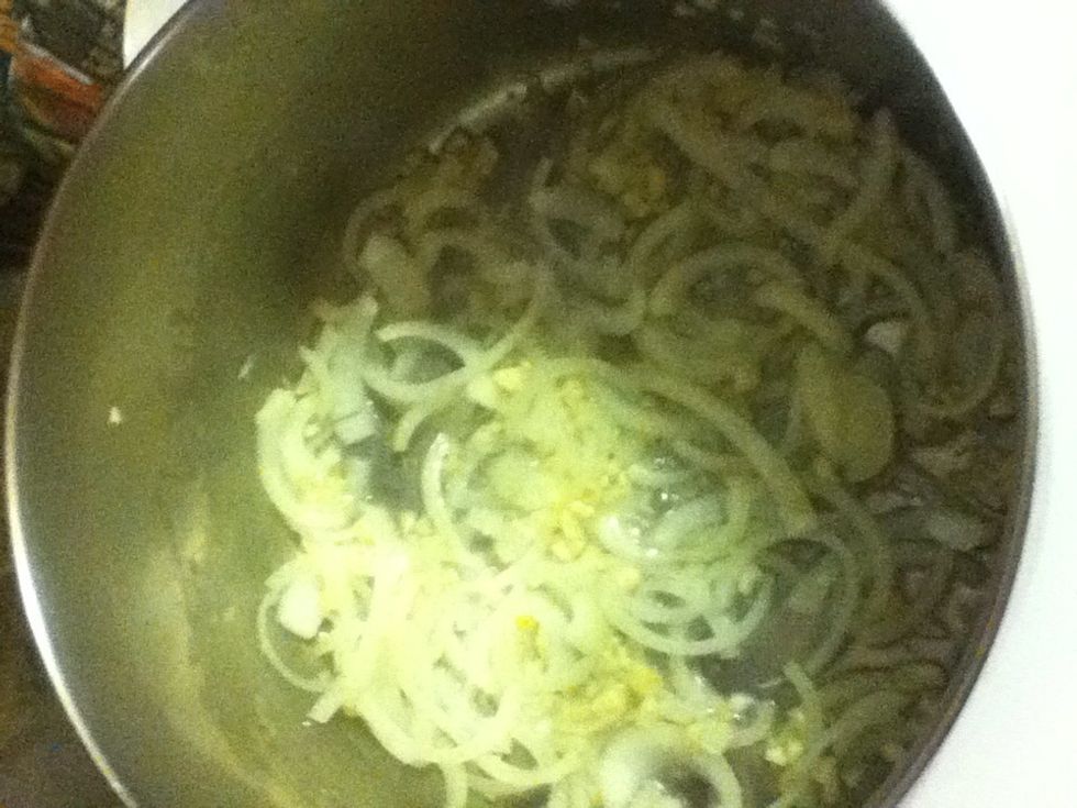 Pour in some oil over medium high and do the onions and garlic until they're gorgeous.