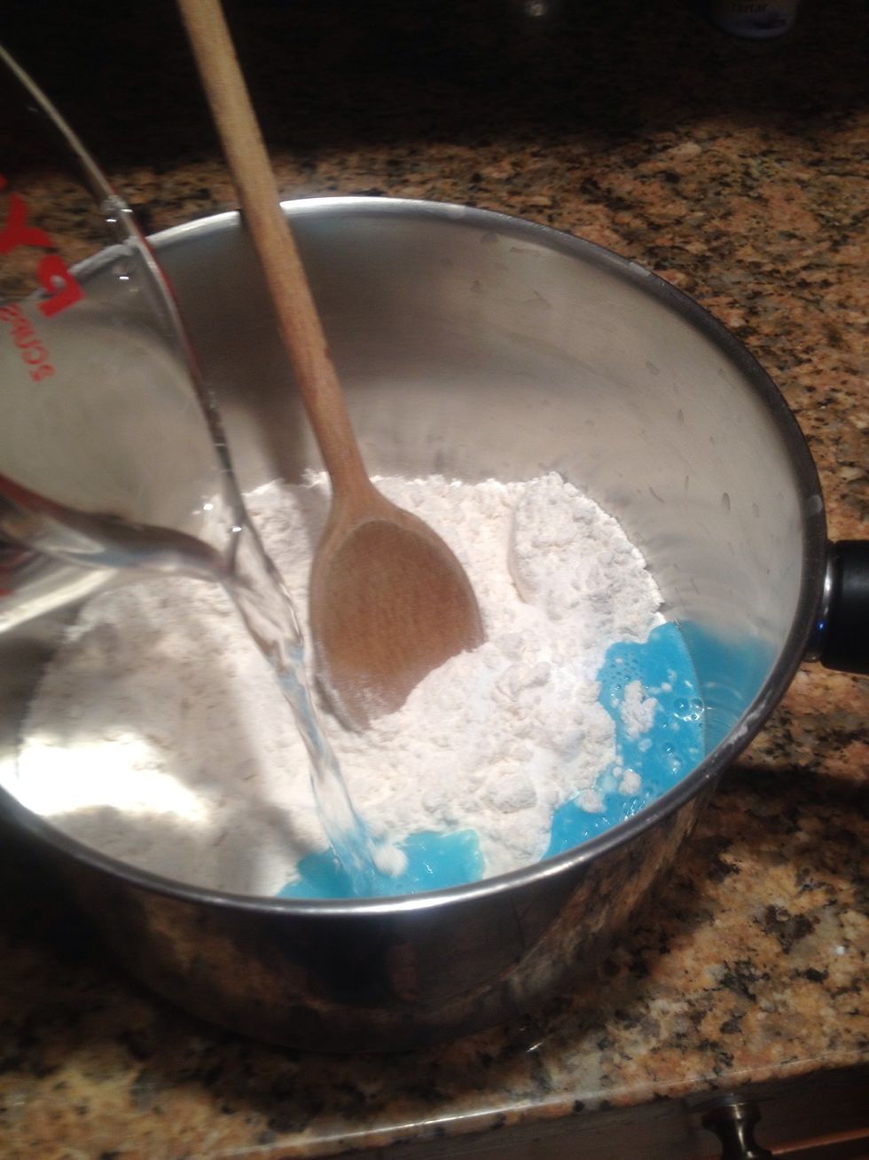 Pour in the 1 cup of warm water. The color of the Kool-Aid is starting to show! So gorgeous!
