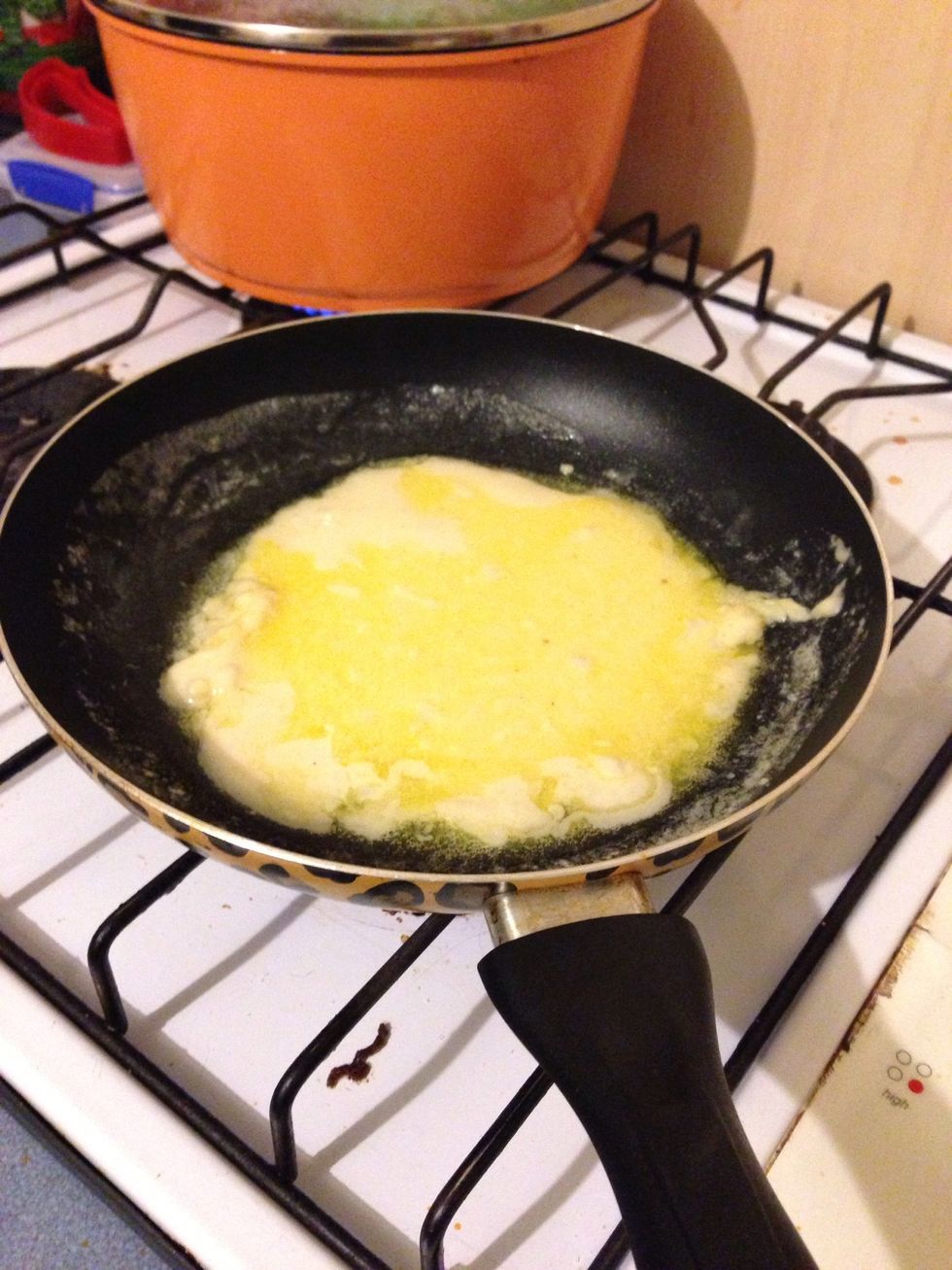 Pour in the batter (see the mass amount of butter on top of the pancake - oops!) . Tilt the pan so the batter spreads. Cook until one side is browned.