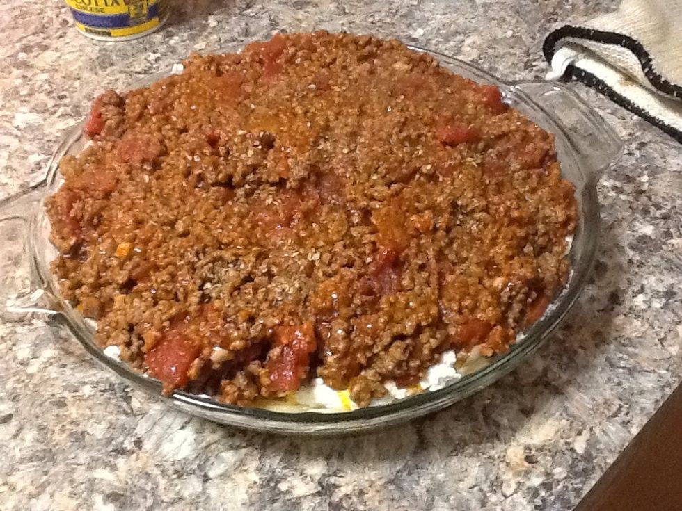 Pour in the beef and tomato mixture.