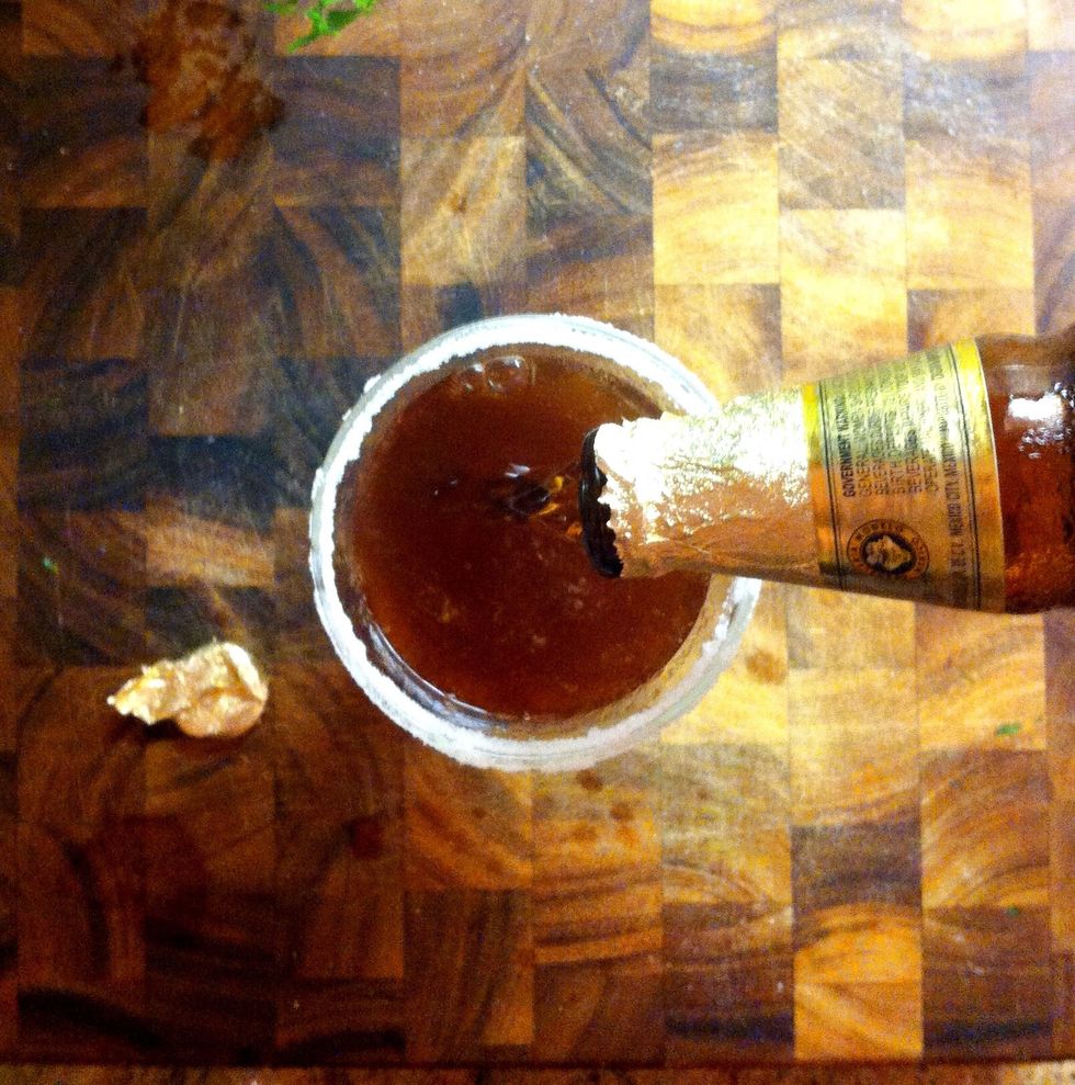 Pour in the beer. You should see fizzing and bubbles.