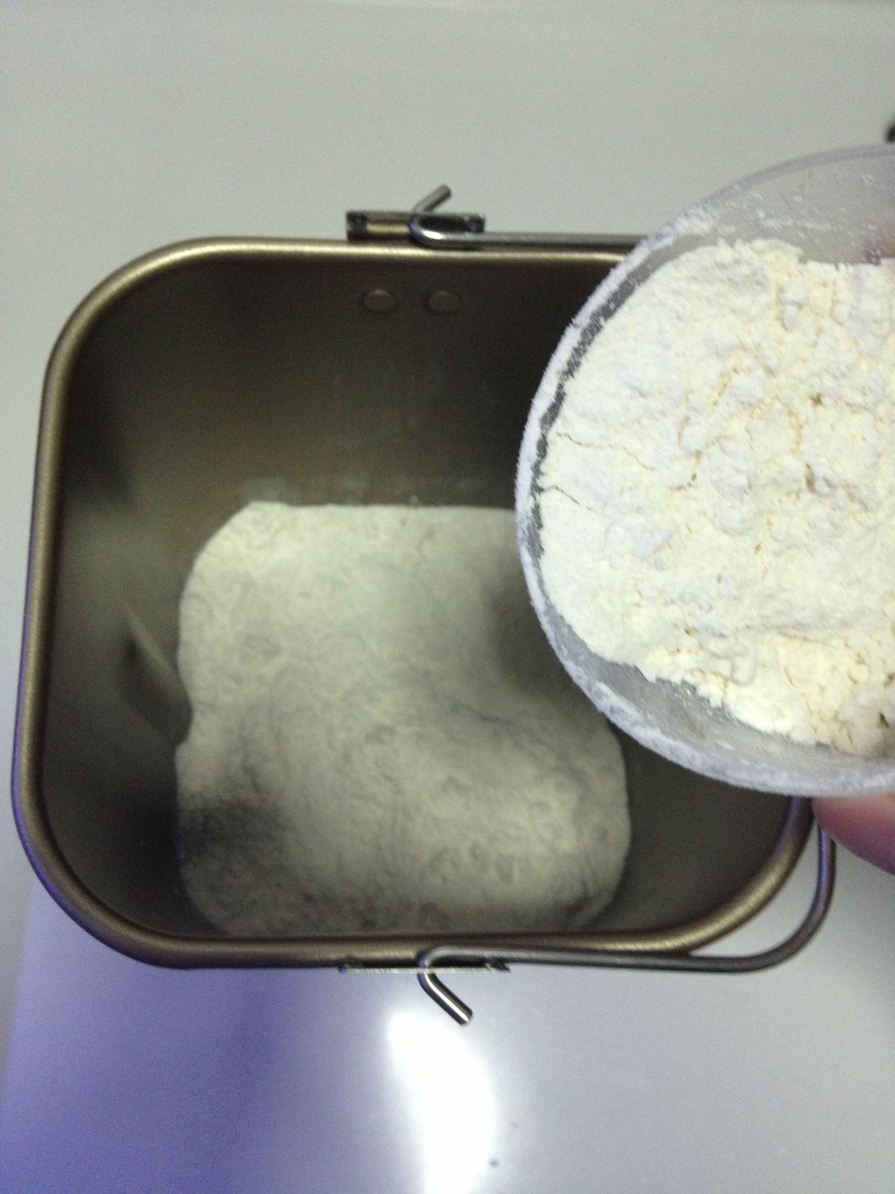 Pour in the bread flour.