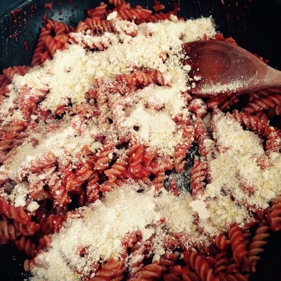 Pour in the breadcrumbs and lemon zest that you prepared. Add some olive oil and mix well together. The breadcrumbs will thicken and dry your sauce