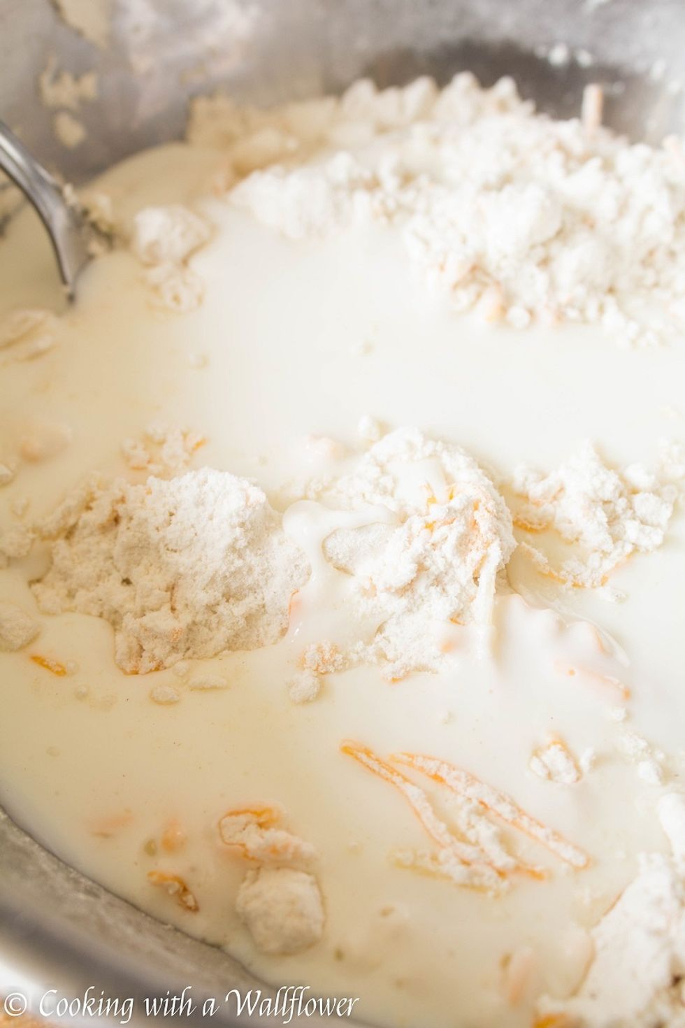 Pour in the buttermilk and stir until the ingredients are wet.