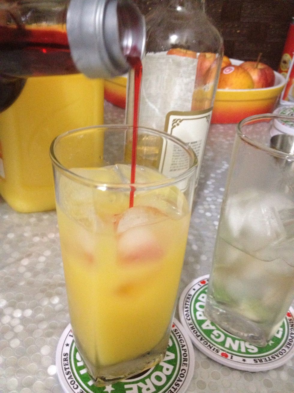 Pour in the grenadine.