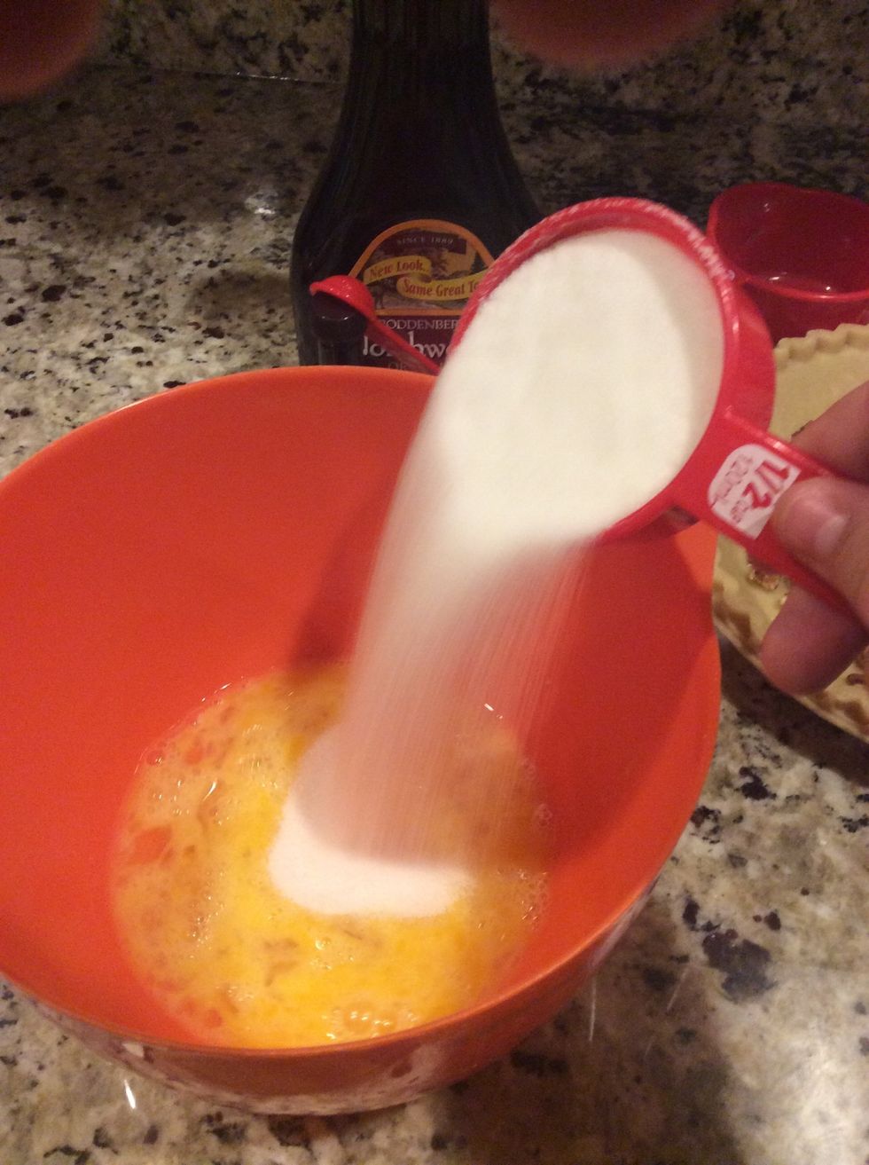 Pour in the half cup of sugar