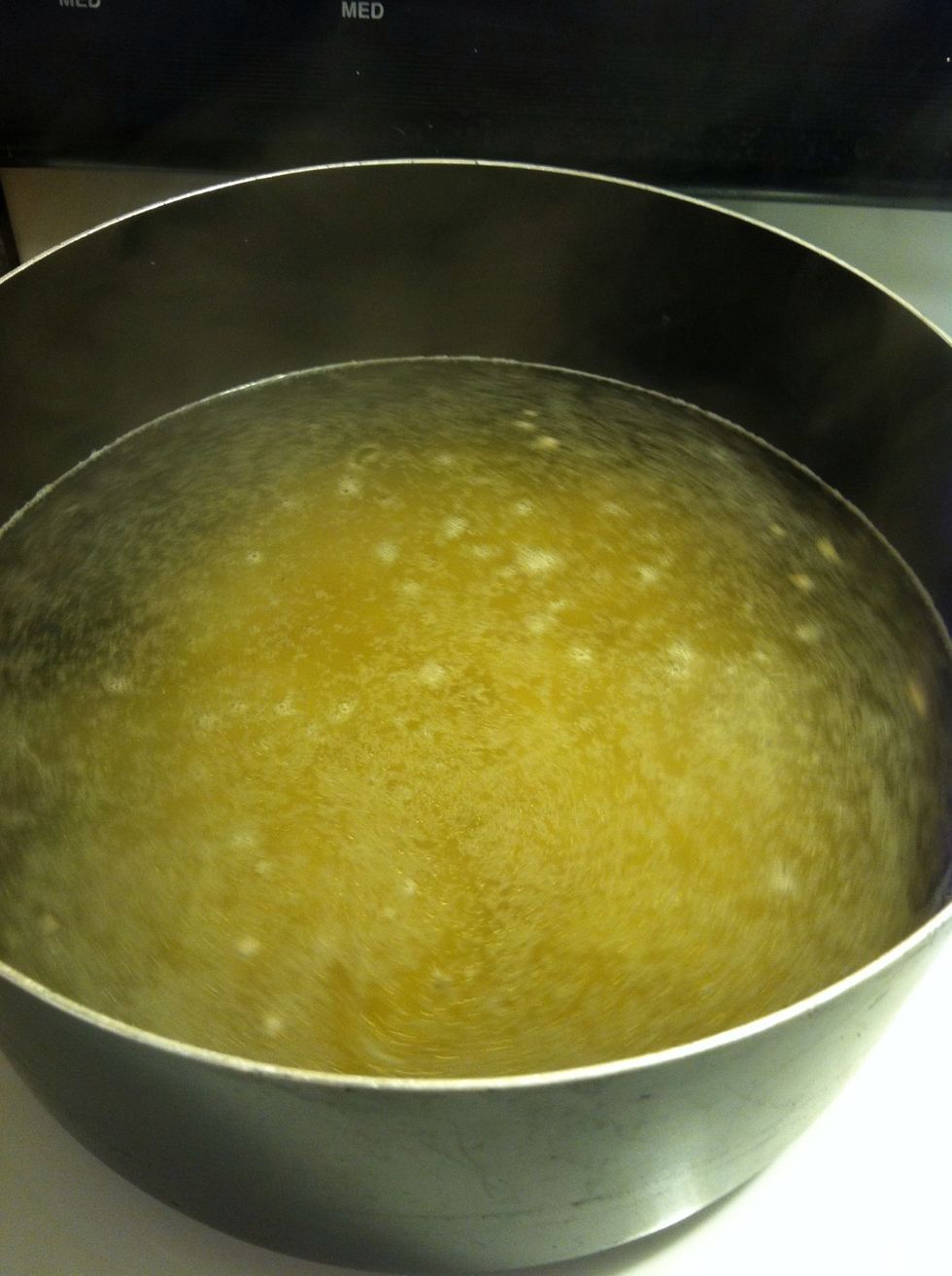 Pour in the macaroni and stir it.