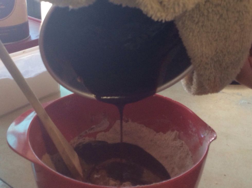 pour in the melted butter and chocolate and 2tsp of milk into the mixing bowl.
