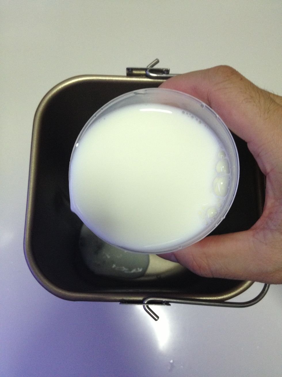 Pour in the milk or water.