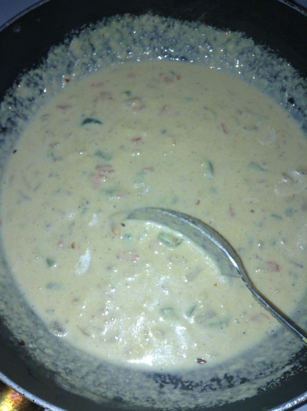 Pour in the milk, stir and bring the mixture to a boil.