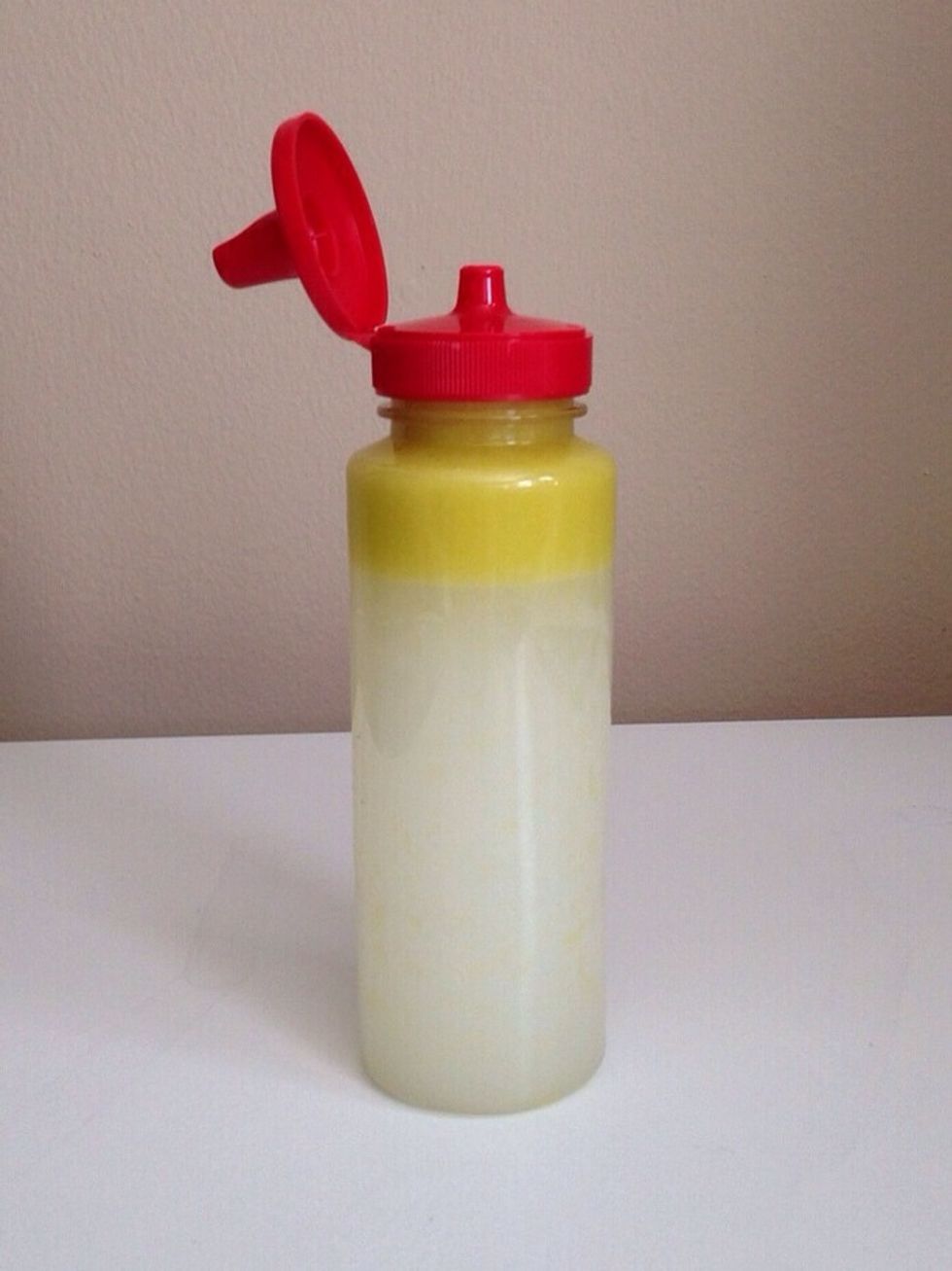Pour in the mixture. After it settles, the oil will rise to the top.