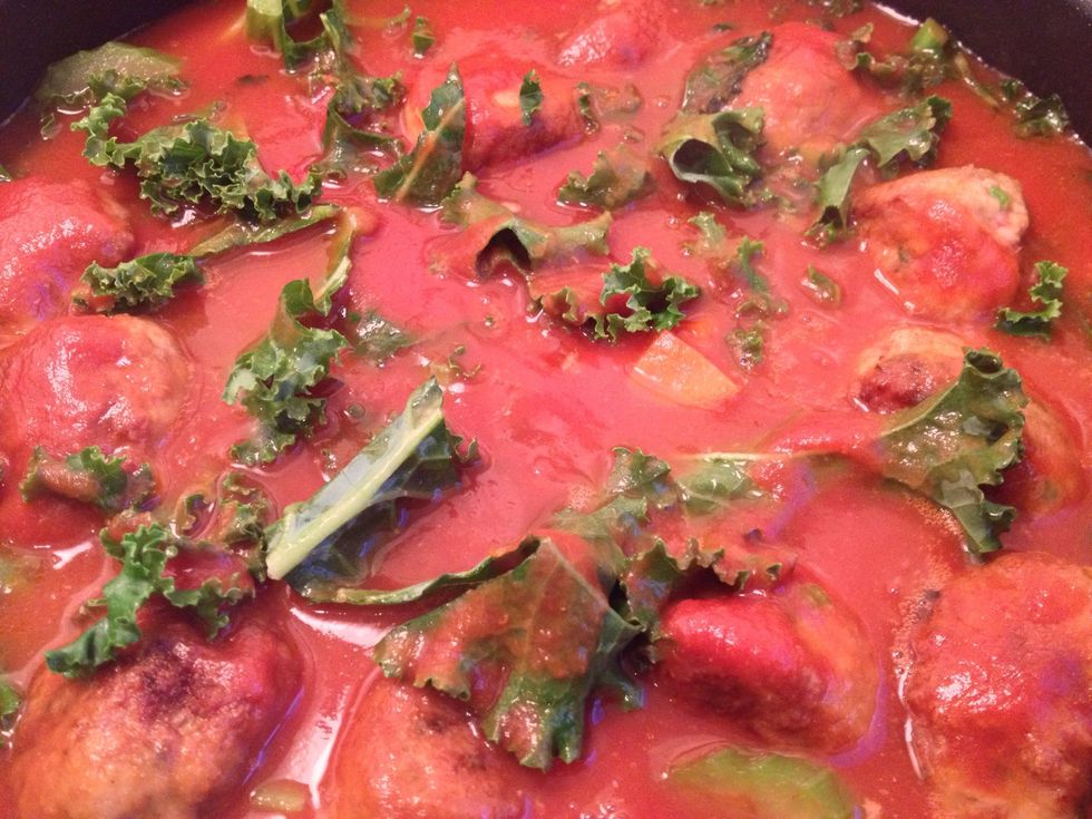 Pour in the passata, then half fill the passata bottle with water, put on the lid and shake. Add this water to the meatballs. Stir in the sugar.